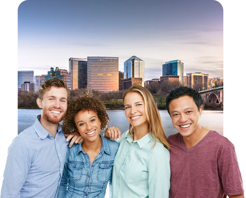 Group of four people in front of a city skyline Group of four people in front of a city skyline
